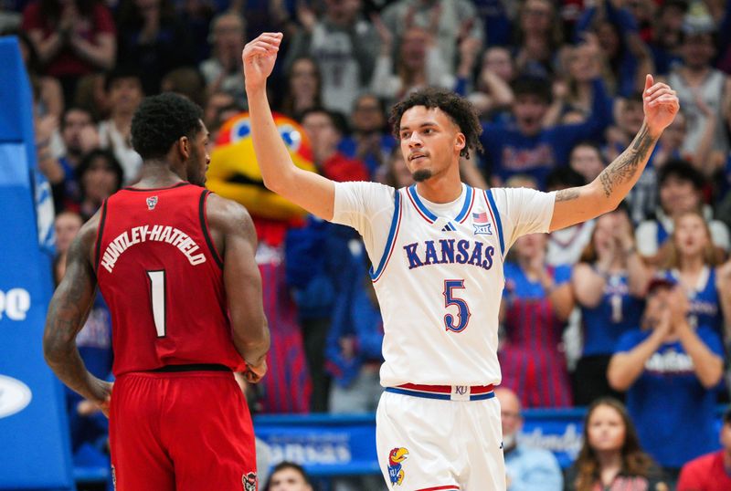 Dec 14, 2024; Lawrence, Kansas, USA; Kansas Jayhawks guard Zeke Mayo (5) rallies the crowd during the second half against the North Caroline State Wolfpack at Allen Fieldhouse. Mandatory Credit: Jay Biggerstaff-Imagn Images
