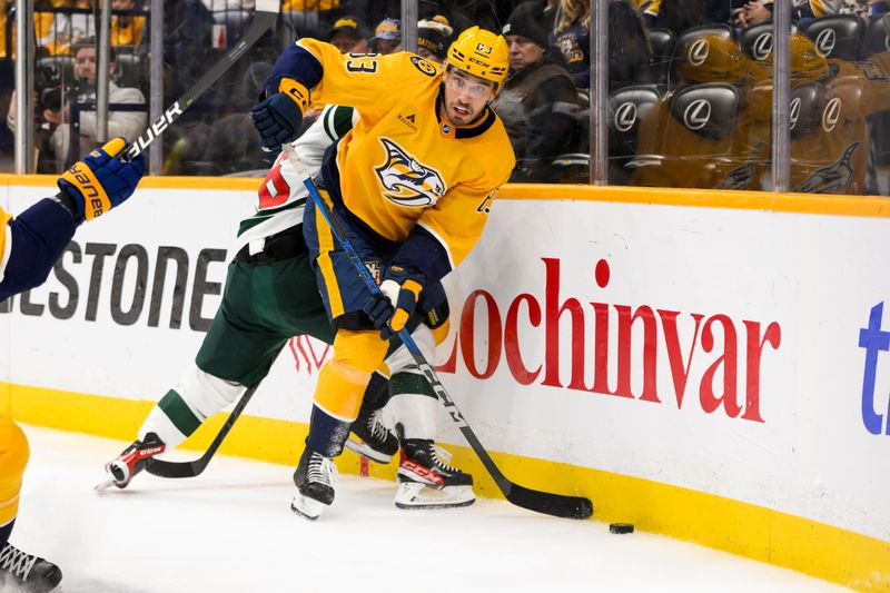 Jan 18, 2025; Nashville, Tennessee, USA;  Minnesota Wild right wing Mats Zuccarello (36) and Nashville Predators defenseman Adam Wilsby (83) battle for the puck during the second period at Bridgestone Arena. Mandatory Credit: Steve Roberts-Imagn Images