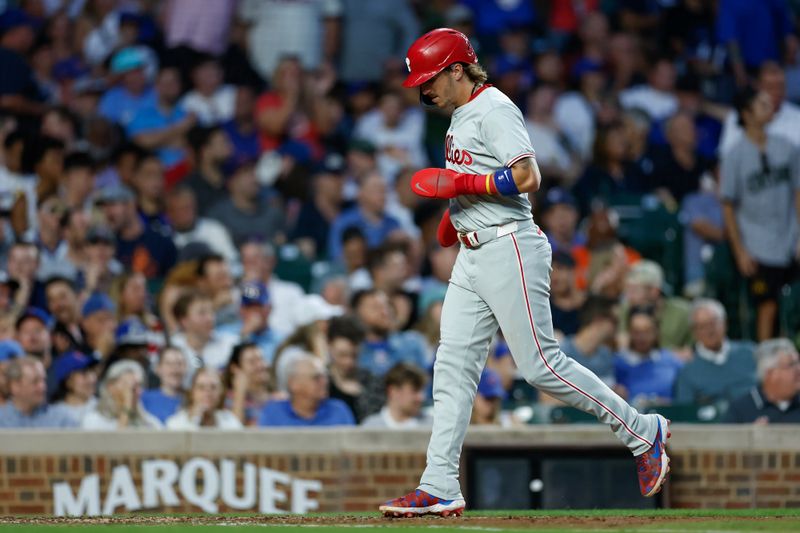 Jul 2, 2024; Chicago, Illinois, USA; Philadelphia Phillies second baseman Bryson Stott (5) scores against the Chicago Cubs during the fifth inning at Wrigley Field. Mandatory Credit: Kamil Krzaczynski-USA TODAY Sports