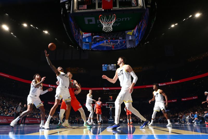 OKLAHOMA CITY, OK - DECEMBER 3: John Collins #20 of the Utah Jazz goes up for the rebound during the game against the Oklahoma City Thunder during the Emirates NBA Cup game on on December 3, 2024 at Paycom Center in Oklahoma City, Oklahoma. NOTE TO USER: User expressly acknowledges and agrees that, by downloading and or using this photograph, User is consenting to the terms and conditions of the Getty Images License Agreement. Mandatory Copyright Notice: Copyright 2024 NBAE (Photo by Zach Beeker/NBAE via Getty Images)