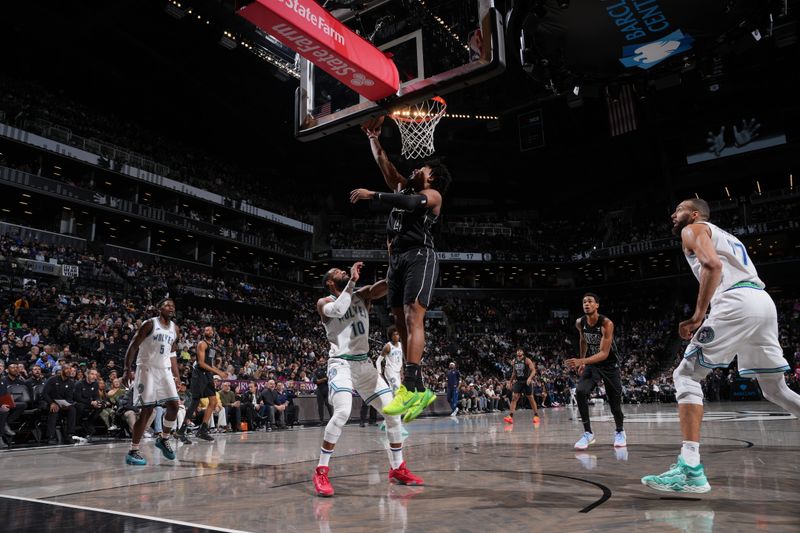 BROOKLYN, NY - JANUARY 25: Dennis Smith Jr. #4 of the Brooklyn Nets drives to the basket during the game against the Minnesota Timberwolves on January 25, 2024 at Barclays Center in Brooklyn, New York. NOTE TO USER: User expressly acknowledges and agrees that, by downloading and or using this Photograph, user is consenting to the terms and conditions of the Getty Images License Agreement. Mandatory Copyright Notice: Copyright 2024 NBAE (Photo by Jesse D. Garrabrant/NBAE via Getty Images)