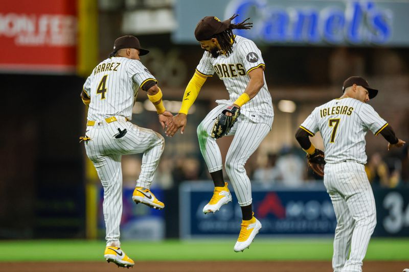 Apr 12, 2025; San Diego, California, USA; San Diego Padres right fielder Fernando Tatis Jr. (23) and San Diego Padres first baseman Luis Arraez (4) celebrate after the San Diego Padres defeat the Colorado Rockies at Petco Park. Mandatory Credit: David Frerker-Imagn Images