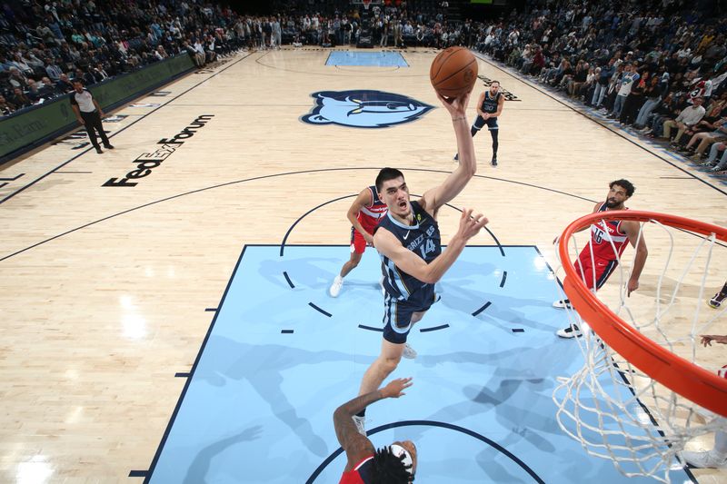 MEMPHIS, TN - NOVEMBER 8: Zach Edey #14 of the Memphis Grizzlies shoots the ball during the game against the Washington Wizards on November 8, 2024 at FedExForum in Memphis, Tennessee. NOTE TO USER: User expressly acknowledges and agrees that, by downloading and or using this photograph, User is consenting to the terms and conditions of the Getty Images License Agreement. Mandatory Copyright Notice: Copyright 2024 NBAE (Photo by Joe Murphy/NBAE via Getty Images)