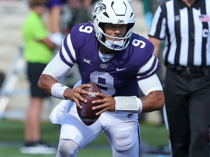 Sep 17, 2022; Manhattan, Kansas, USA; Kansas State Wildcats quarterback Adrian Martinez (9) scrambles against the Tulane Green Wave during the third quarter at Bill Snyder Family Football Stadium. Mandatory Credit: Scott Sewell-USA TODAY Sports