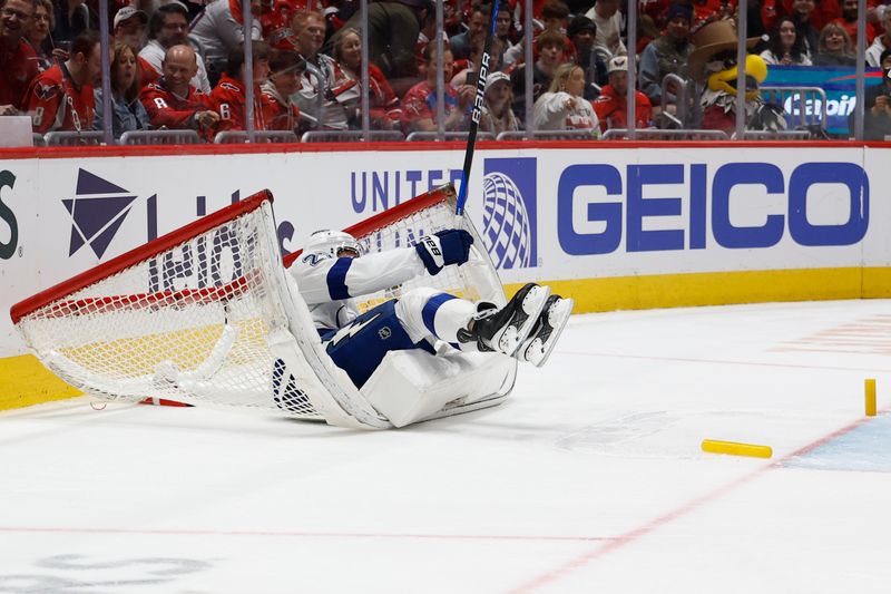 Mar 1, 2025; Washington, District of Columbia, USA; Tampa Bay Lightning defenseman Ryan McDonagh (27) crashes into the net against the Washington Capitals in the third period at Capital One Arena. Mandatory Credit: Geoff Burke-Imagn Images