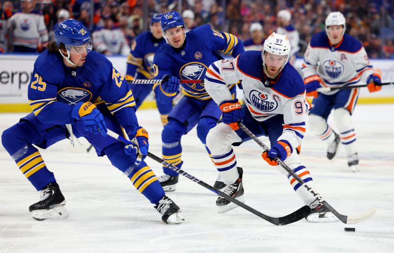 Mar 9, 2024; Buffalo, New York, USA;  Edmonton Oilers center Connor McDavid (97) looks to make a pass as Buffalo Sabres defenseman Owen Power (25) defends during the first period at KeyBank Center. Mandatory Credit: Timothy T. Ludwig-USA TODAY Sports