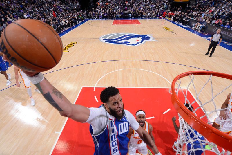 SACRAMENTO, CA - JANUARY 22: JaVale McGee #00 of the Sacramento Kings drives to the basket during the game against the Atlanta Hawks on January 22, 2024 at Golden 1 Center in Sacramento, California. NOTE TO USER: User expressly acknowledges and agrees that, by downloading and or using this Photograph, user is consenting to the terms and conditions of the Getty Images License Agreement. Mandatory Copyright Notice: Copyright 2024 NBAE (Photo by Rocky Widner/NBAE via Getty Images)