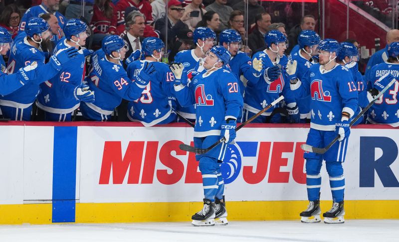 Jan 29, 2026; Montreal, Quebec, CAN; Colorado Avalanche forward Ross Colton (20) celebrates with teammates after scoring a goal against the Montreal Canadiens during the third period at the Bell Centre. Mandatory Credit: Eric Bolte-Imagn Images