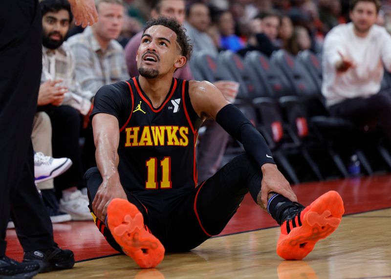 HOUSTON, TEXAS - DECEMBER 20: Trae Young #11 of the Atlanta Hawks reacts to a call against the Houston Rockets during the first half at Toyota Center on December 20, 2023 in Houston, Texas. User expressly acknowledges and agrees that, by downloading and or using this photograph, User is consenting to the terms and conditions of the Getty Images License Agreement.?  (Photo by Carmen Mandato/Getty Images)