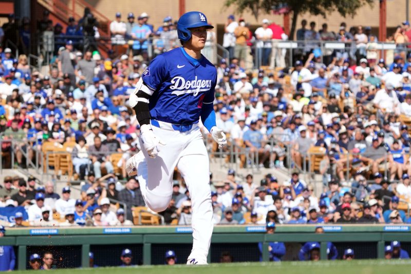 Mar 10, 2024; Phoenix, Arizona, USA; Los Angeles Dodgers designated hitter Shohei Ohtani (17) runs to first base en route to a ground out during the fourth inning at Camelback Ranch-Glendale. Mandatory Credit: Joe Camporeale-USA TODAY Sports