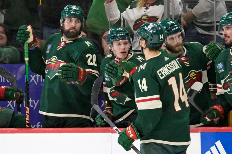 Jan 25, 2024; Saint Paul, Minnesota, USA; Minnesota Wild forward Joel Eriksson Ek (14) celebrates his power play goal against the Nashville Predators with forward Ryan Hartman (38), forward Marco Rossi (23), and forward Pat Maroon (20) during the second period at Xcel Energy Center. Mandatory Credit: Nick Wosika-USA TODAY Sports