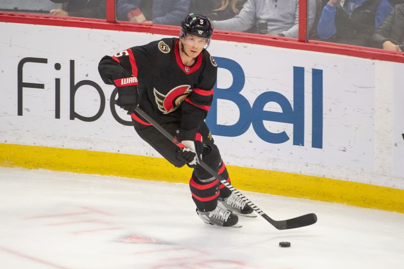 Oct 20, 2022; Ottawa, Ontario, CAN; Ottawa Senators defenseman Nick Holden (5) skates with the puck in the third period against the Washington Capitals at the Canadian Tire Centre. Mandatory Credit: Marc DesRosiers-USA TODAY Sports