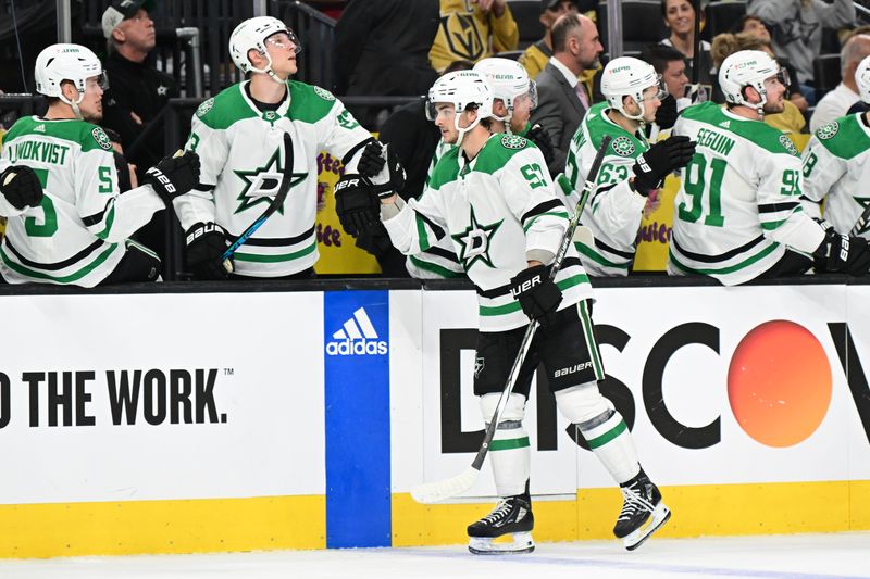 Apr 27, 2024; Las Vegas, Nevada, USA; Dallas Stars center Wyatt Johnston (53) celebrates his first-period goal against the Vegas Golden Knights with teammates on the bench in game three of the first round of the 2024 Stanley Cup Playoffs at T-Mobile Arena. Mandatory Credit: Candice Ward-USA TODAY Sports