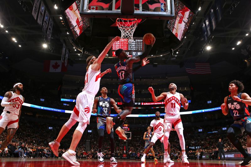 TORONTO, CANADA - MARCH 25: Dennis Schroder #17 of the Brooklyn Nets drives to the basket during the game against the Toronto Raptors on March 25, 2024 at the Scotiabank Arena in Toronto, Ontario, Canada.  NOTE TO USER: User expressly acknowledges and agrees that, by downloading and or using this Photograph, user is consenting to the terms and conditions of the Getty Images License Agreement.  Mandatory Copyright Notice: Copyright 2024 NBAE (Photo by Vaughn Ridley/NBAE via Getty Images)