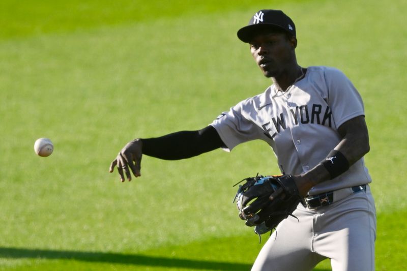 Apr 22, 2025; Cleveland, Ohio, USA; New York Yankees second baseman Jazz Chisholm Jr. (13) throws to first base in the second inning against the Cleveland Guardians at Progressive Field. Mandatory Credit: David Richard-Imagn Images