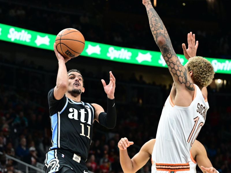 ATLANTA, GA - JANUARY 15: Trae Young #11 of the Atlanta Hawks shoots the ball during the game against the San Antonio Spurs on January 15, 2024 at State Farm Arena in Atlanta, Georgia.  NOTE TO USER: User expressly acknowledges and agrees that, by downloading and/or using this Photograph, user is consenting to the terms and conditions of the Getty Images License Agreement. Mandatory Copyright Notice: Copyright 2024 NBAE (Photo by Adam Hagy/NBAE via Getty Images)