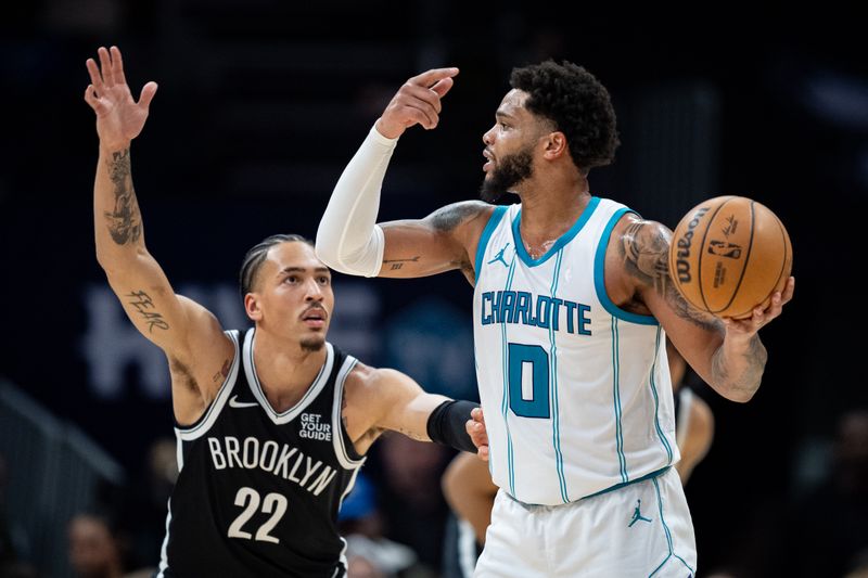 CHARLOTTE, NORTH CAROLINA - JANUARY 29: Jalen Wilson #22 of the Brooklyn Nets guards Miles Bridges #0 of the Charlotte Hornets in the third quarter at Spectrum Center on January 29, 2025 in Charlotte, North Carolina. NOTE TO USER: User expressly acknowledges and agrees that, by downloading and or using this photograph, User is consenting to the terms and conditions of the Getty Images License Agreement. (Photo by Jacob Kupferman/Getty Images)