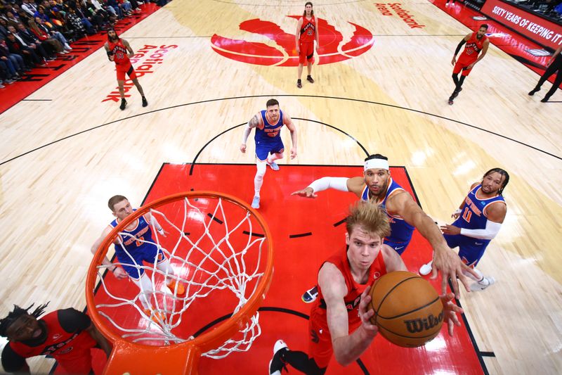 TORONTO, CANADA - MARCH 27: Gradey Dick #1 of the Toronto Raptors drives to the basket during the game against the New York Knicks on March 27, 2024 at the Scotiabank Arena in Toronto, Ontario, Canada.  NOTE TO USER: User expressly acknowledges and agrees that, by downloading and or using this Photograph, user is consenting to the terms and conditions of the Getty Images License Agreement.  Mandatory Copyright Notice: Copyright 2024 NBAE (Photo by Vaughn Ridley/NBAE via Getty Images)