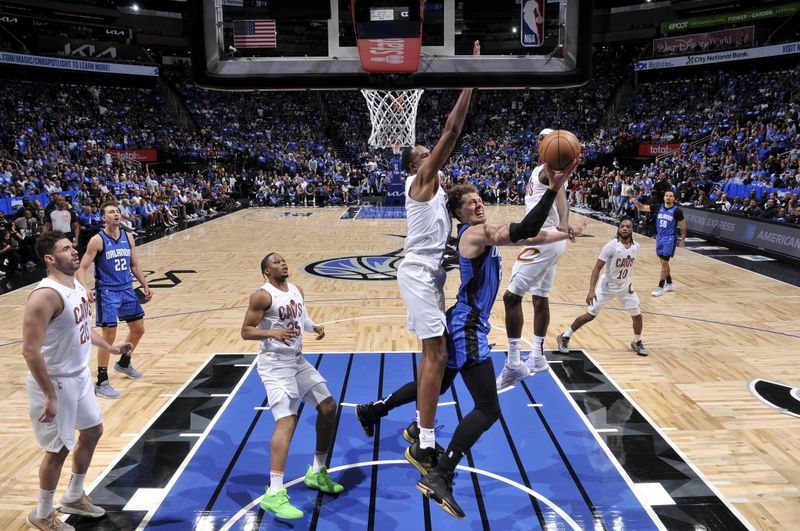 ORLANDO, FL - APRIL 27: Moritz Wagner #21 of the Orlando Magic drives to the basket during the game against the Cleveland Cavaliers during Round 1 Game 4 of the 2024 NBA Playoffs on April 27, 2024 at the Kia Center in Orlando, Florida. NOTE TO USER: User expressly acknowledges and agrees that, by downloading and or using this photograph, User is consenting to the terms and conditions of the Getty Images License Agreement. Mandatory Copyright Notice: Copyright 2024 NBAE (Photo by Fernando Medina/NBAE via Getty Images)