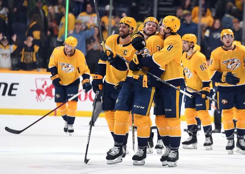 Jan 21, 2023; Nashville, Tennessee, USA; Nashville Predators left wing Cole Smith (36) and center Cody Glass (8) celebrate after a win against the Los Angeles Kings at Bridgestone Arena. Mandatory Credit: Christopher Hanewinckel-USA TODAY Sports