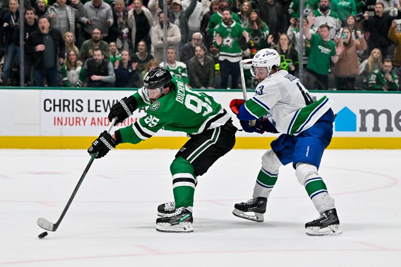 Dec 21, 2023; Dallas, Texas, USA; Dallas Stars center Matt Duchene (95) scores the game winning goal past Vancouver Canucks defenseman Quinn Hughes (43) during the overtime period at the American Airlines Center. Mandatory Credit: Jerome Miron-USA TODAY Sports