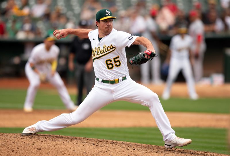 Sep 2, 2023; Oakland, California, USA; Oakland Athletics pitcher Trevor May (65) delivers a pitch against the Los Angeles Angels during the ninth inning at Oakland-Alameda County Coliseum. Mandatory Credit: D. Ross Cameron-USA TODAY Sports