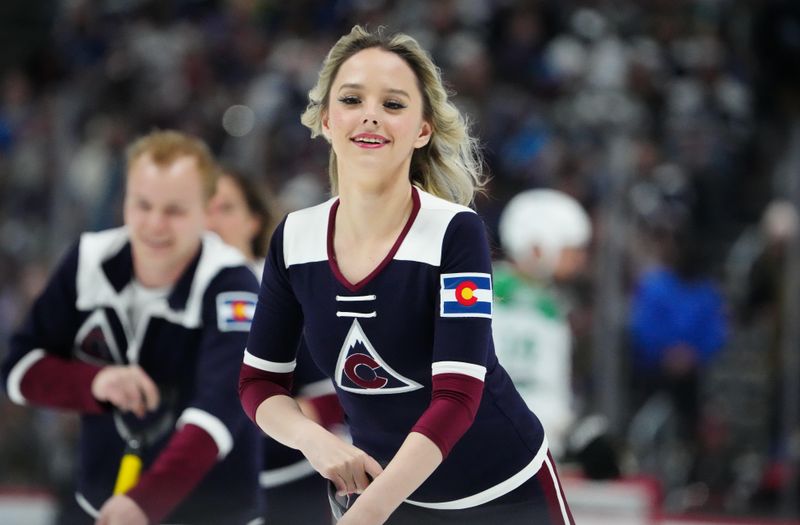 Apr 7, 2024; Denver, Colorado, USA; Colorado Avalanche ice patrol clears the ice in the second period against the Dallas Stars at Ball Arena. Mandatory Credit: Ron Chenoy-USA TODAY Sports