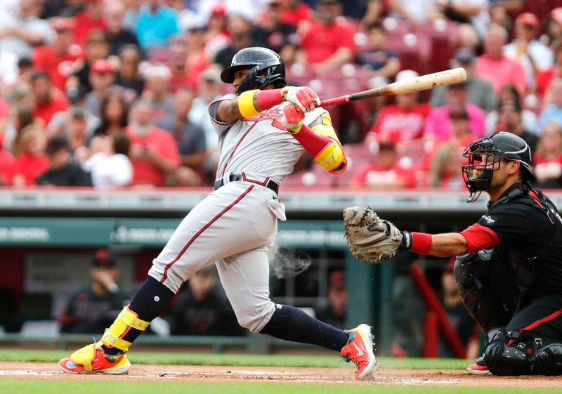 Jun 23, 2023; Cincinnati, Ohio, USA; Atlanta Braves right fielder Ronald Acuna Jr. (13) hits a single against the Cincinnati Reds during the first inning at Great American Ball Park. Mandatory Credit: David Kohl-USA TODAY Sports