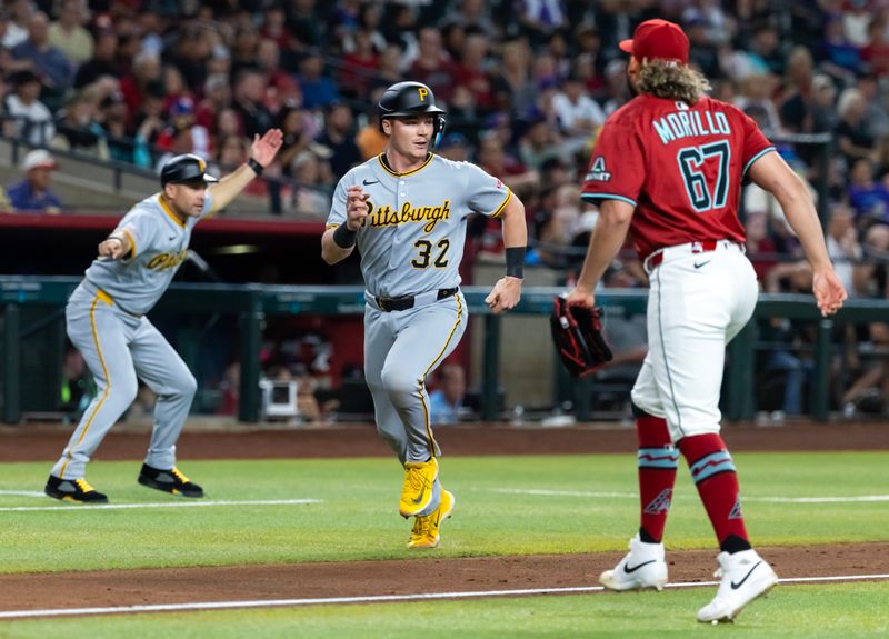 May 28, 2025; Phoenix, Arizona, USA; Pittsburgh Pirates catcher Henry Davis scores in the sixth inning against the Arizona Diamondbacks at Chase Field. Mandatory Credit: Mark J. Rebilas-Imagn Images