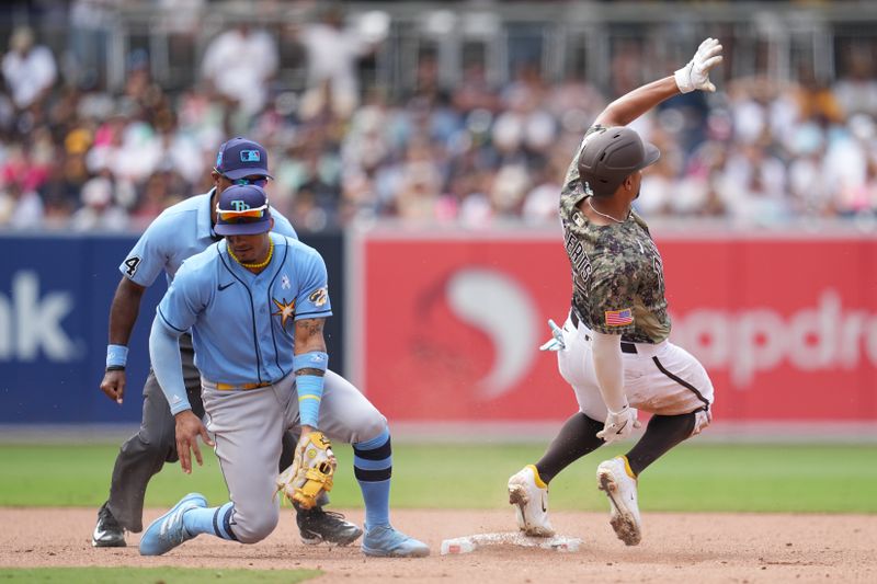 Jun 18, 2023; San Diego, California, USA;  San Diego Padres shortstop Xander Bogaerts (2) beats the tag by Tampa Bay Rays shortstop Wander Franco (5) to steal second base during the eighth inning at Petco Park. Mandatory Credit: Ray Acevedo-USA TODAY Sports