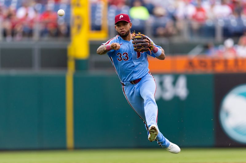 May 23, 2024; Philadelphia, Pennsylvania, USA; Philadelphia Phillies shortstop Edmundo Sosa (33) throws out a Texas Rangers runner during the fourth inning at Citizens Bank Park. Mandatory Credit: Bill Streicher-USA TODAY Sports