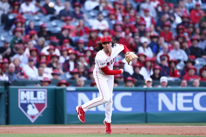 May 24, 2024; Anaheim, California, USA; Los Angeles Angels third base Cole Tucker (8) throws to first base against a Cleveland Guardians during first inning of a game at Angel Stadium. Mandatory Credit: Jessica Alcheh-USA TODAY Sports