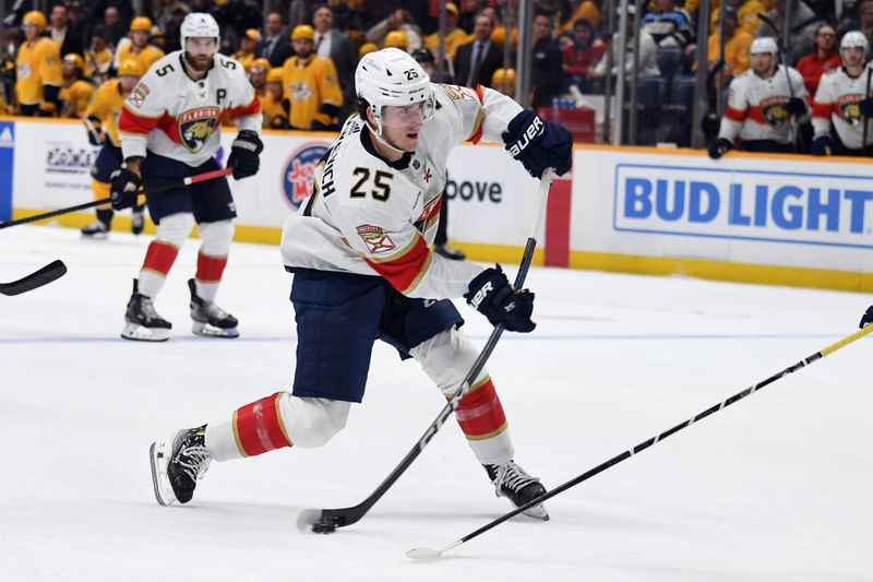 Jan 22, 2024; Nashville, Tennessee, USA; Florida Panthers right wing Mackie Samoskevich (25) shoots the puck during the second period against the Nashville Predators at Bridgestone Arena. Mandatory Credit: Christopher Hanewinckel-USA TODAY Sports