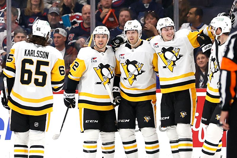 Oct 20, 2024; Winnipeg, Manitoba, CAN; Pittsburgh Penguins center Lars Eller (20) celebrates his second period goal against the Winnipeg Jets at Canada Life Centre. Mandatory Credit: James Carey Lauder-Imagn Images