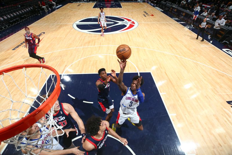 WASHINGTON, DC -? MARCH 8:  Davion Warren #3 of the Long Island Nets goes to the basket during the game against the Capital City Go-Go on March 8, 2024 at Capital One Arena in Washington, DC. NOTE TO USER: User expressly acknowledges and agrees that, by downloading and or using this Photograph, user is consenting to the terms and conditions of the Getty Images License Agreement. Mandatory Copyright Notice: Copyright 2024 NBAE (Photo by Stephen Gosling/NBAE via Getty Images)