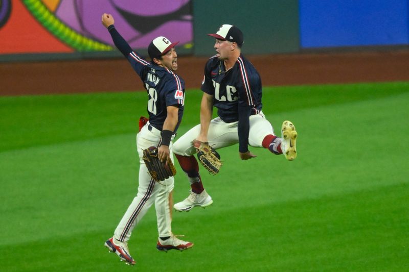 Jun 4, 2024; Cleveland, Ohio, USA; Cleveland Guardians left fielder Steven Kwan (38) and right fielder Will Brennan (17) celebrate a win over the Kansas City Royals at Progressive Field. Mandatory Credit: David Richard-USA TODAY Sports