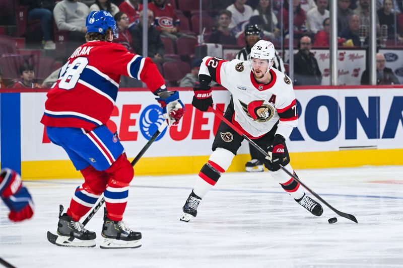 Oct 1, 2024; Montreal, Quebec, CAN; Montreal Canadiens defenseman Arber Xhekaj (72) plays the puck against Montreal Canadiens center Christian Dvorak (28) during the first period at Bell Centre. Mandatory Credit: David Kirouac-Imagn Images