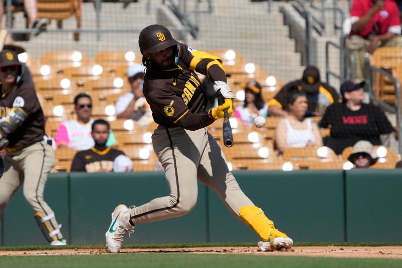 Feb 28, 2024; Phoenix, Arizona, USA; San Diego Padres designated hitter Luis Campusano (12) hits against the Chicago White Sox in the first inning at Camelback Ranch-Glendale. Mandatory Credit: Rick Scuteri-USA TODAY Sports