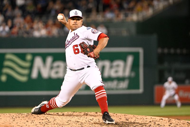 Apr 4, 2023; Washington, District of Columbia, USA; Washington Nationals relief pitcher Erasmo Ramirez (61) throws to the Tampa Bay Rays during the sixth inning at Nationals Park. Mandatory Credit: Brad Mills-USA TODAY Sports