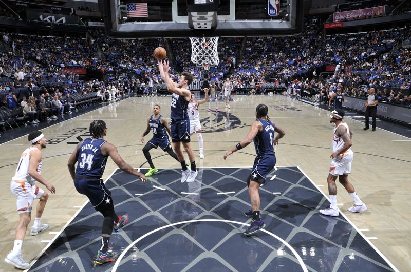 ORLANDO, FL - JANUARY 28: Franz Wagner #22 of the Orlando Magic grabs the rebound during the game on January 28, 2024 at Amway Center in Orlando, Florida. NOTE TO USER: User expressly acknowledges and agrees that, by downloading and or using this photograph, User is consenting to the terms and conditions of the Getty Images License Agreement. Mandatory Copyright Notice: Copyright 2024 NBAE (Photo by Fernando Medina/NBAE via Getty Images)