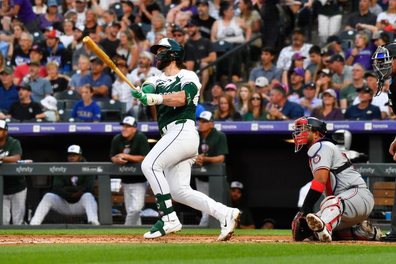 Jun 22, 2024; Denver, Colorado, USA;  Colorado Rockies second base Brendan Rodgers (7) hits a three run home runagainst the Washington Nationals  in the third inning at Coors Field. Mandatory Credit: John Leyba-USA TODAY Sports