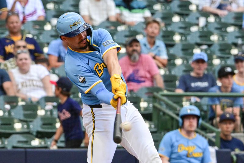 Jul 14, 2024; Milwaukee, Wisconsin, USA; Milwaukee Brewers shortstop Willy Adames (27) hits a two-run home run in the eighth inning against the Washington Nationals at American Family Field. Mandatory Credit: Benny Sieu-USA TODAY Sports