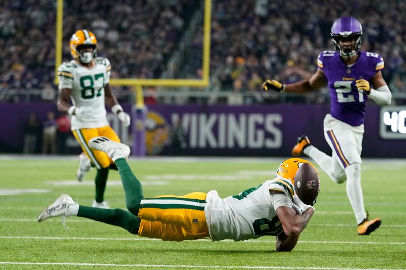 Green Bay Packers' Bo Melton catcn't catch a pass during the first half of an NFL football game against the Minnesota Vikings Sunday, Dec. 31, 2023, in Minneapolis. (AP Photo/Abbie Parr)