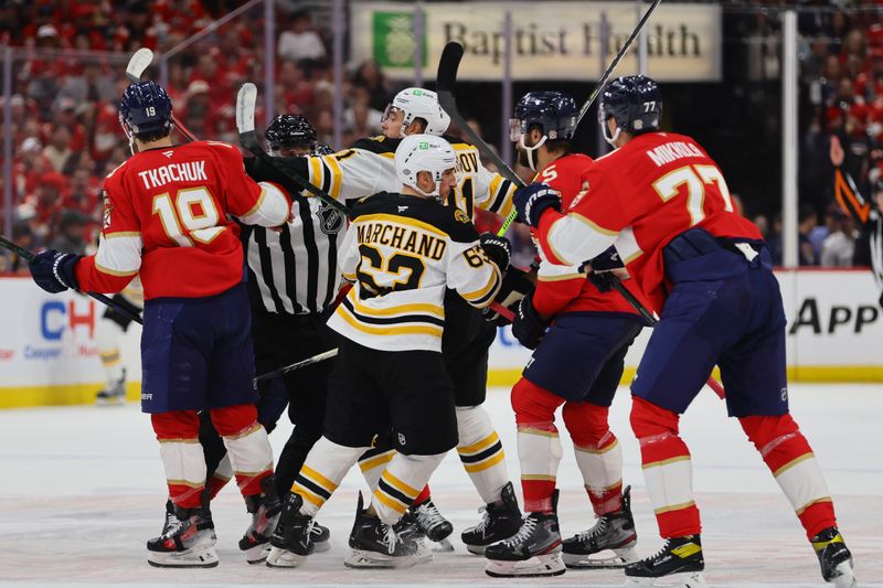 Oct 8, 2024; Sunrise, Florida, USA; Florida Panthers left wing Matthew Tkachuk (19) and Boston Bruins center Trent Frederic (11) push each other during the first period at Amerant Bank Arena. Mandatory Credit: Sam Navarro-Imagn Images