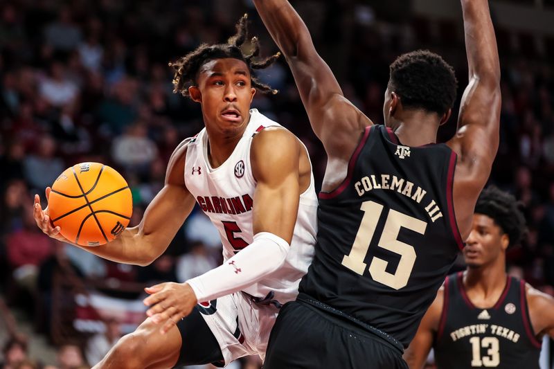 Jan 14, 2023; Columbia, South Carolina, USA; South Carolina Gamecocks guard Meechie Johnson (5) passes around Texas A&M Aggies forward Henry Coleman III (15) in the first half at Colonial Life Arena. Mandatory Credit: Jeff Blake-USA TODAY Sports