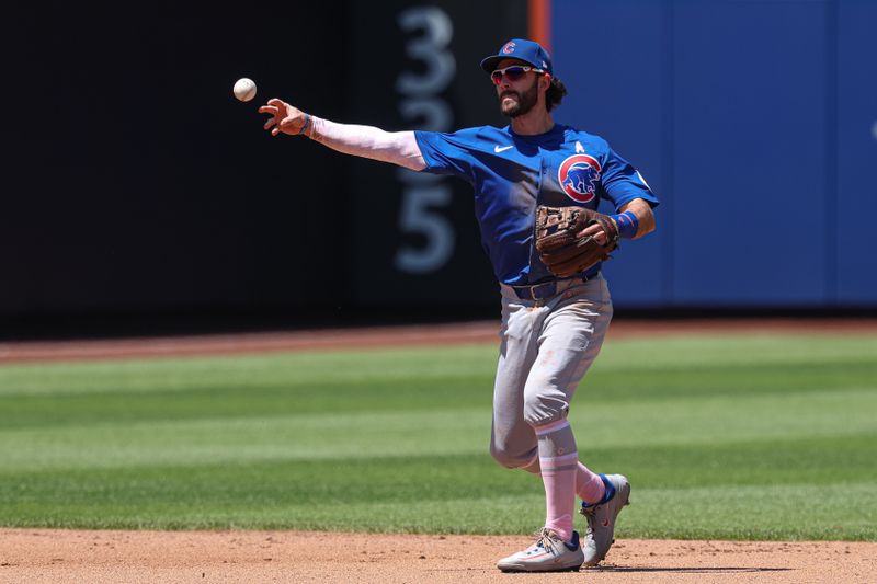May 11, 2025; New York City, New York, USA; Chicago Cubs shortstop Dansby Swanson (7) throws the ball for an out to first base during the fourth inning against the New York Mets at Citi Field. Mandatory Credit: Vincent Carchietta-Imagn Images