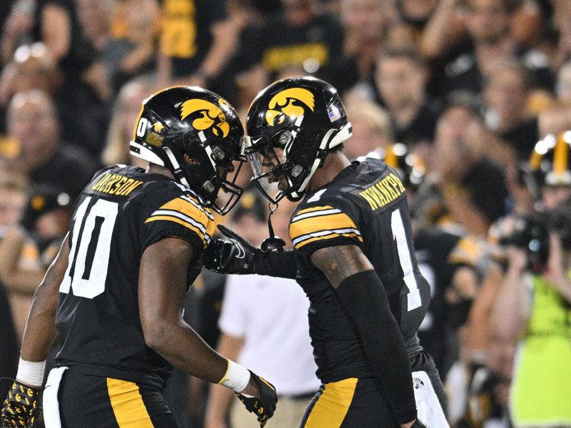 Sep 30, 2023; Iowa City, Iowa, USA; Iowa Hawkeyes linebacker Nick Jackson (10) and defensive back Xavier Nwankpa (1) react against the Michigan State Spartans during the second quarter at Kinnick Stadium. Mandatory Credit: Jeffrey Becker-USA TODAY Sports