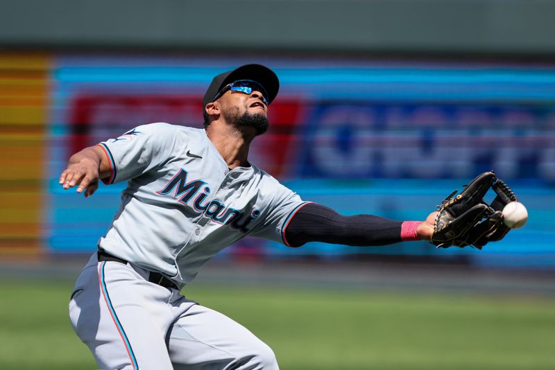 Jun 26, 2024; Kansas City, Missouri, USA; Miami Marlins second base Otto Lopez (61) misses a pop fly against the Kansas City Royals during the eighth inning at Kauffman Stadium. Mandatory Credit: William Purnell-USA TODAY Sports