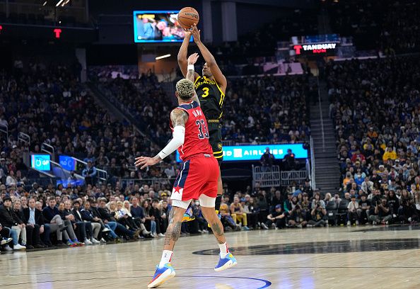 SAN FRANCISCO, CALIFORNIA - DECEMBER 22:  Chris Paul #3 of the Golden State Warriors shoots over Kyle Kuzma #33 of the Washington Wizards during the first half at Chase Center on December 22, 2023 in San Francisco, California. NOTE TO USER: User expressly acknowledges and agrees that, by downloading and or using this photograph, User is consenting to the terms and conditions of the Getty Images License Agreement. (Photo by Thearon W. Henderson/Getty Images)