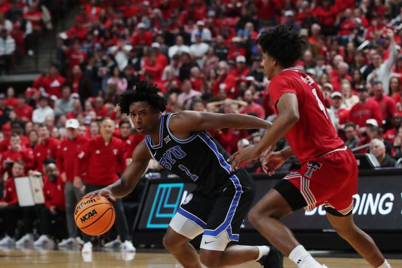 Jan 17, 2026; Lubbock, Texas, USA;  BYU Cougars guard Robert Wright III (1) works the ball around Texas Tech Red Raiders guard Christian Anderson (4) in the second half at United Supermarkets Arena. Mandatory Credit: Michael C. Johnson-Imagn Images
